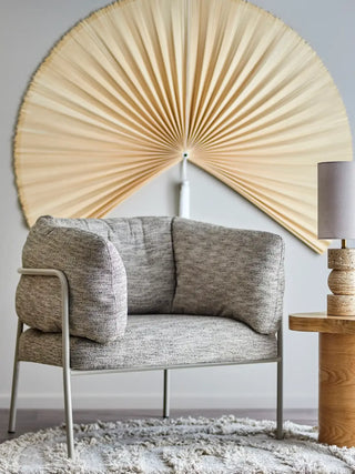 Loungefauteuil beige karel 80cm van Bloomingville, schuin van voren met vorm en afwerking zichtbaar