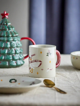 Andere zijde van de Mary mok op een gedekte kersttafel