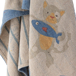 Plaid Mille van gerecycled katoen 130x160cm van Bloomingville Mini, los gedrapeerd in een sfeervolle interieursetting