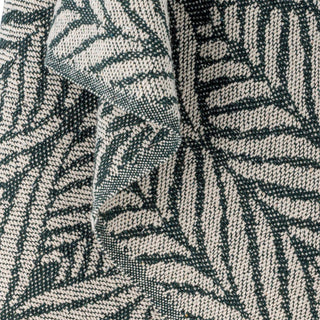 Plaid gerecycled katoen groen Ugento 130x160cm van Bloomingville, toegepast in een stijlvolle woonkamer