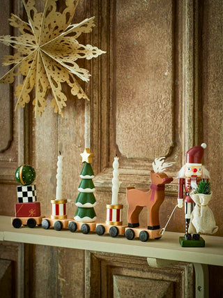 Vadim kersttrein met notenkraker op een houten schouw