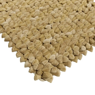 Pebble kleed 65x95cm Dessert mix van Haans Lifestyle, toegepast op een stoel of bank in een interieursetting
