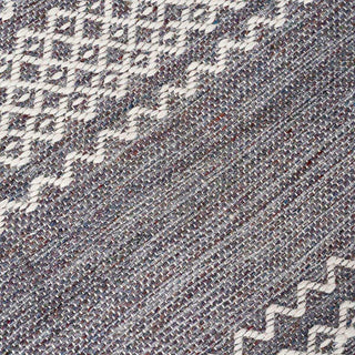 Close-up van buitenkleed Ciero met gemêleerd weefsel en contrasterend geometrisch patroon