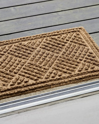 Deurmat Clean naturel 60x40cm van House Doctor, toegepast in een sfeervolle interieursetting