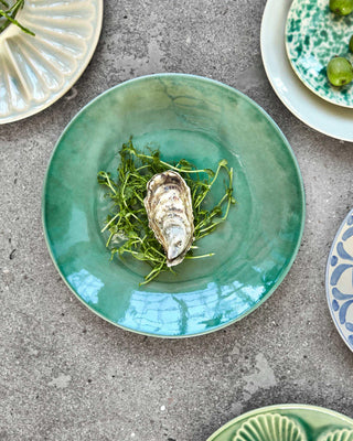 Dinerbord Diva groen 28cm van House Doctor, toegepast in een sfeervolle interieursetting