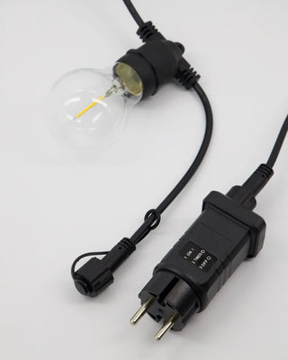Lichtketting Light in zwart voor binnen en buiten van House Doctor, in een gestileerde detailopstelling