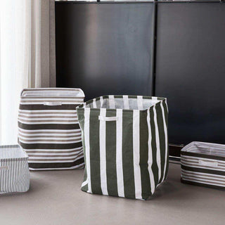Opbergmand Store groen groot van House Doctor, toegepast in een sfeervolle interieursetting