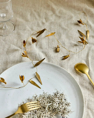 Slinger Snowdrop champagnekleurig van House Doctor, toegepast in een sfeervolle interieursetting