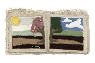 Open stoffen Garden-boek met een boom, zon en wolken.