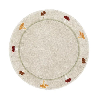 Rond naturel vloerkleed met kleine paddenstoelen langs de rand.