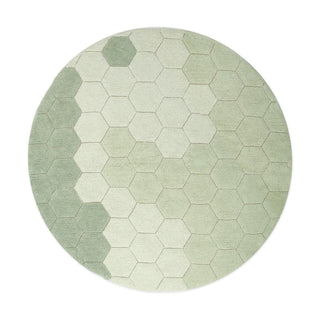 Rond blauwgroen honingraatvloerkleed.