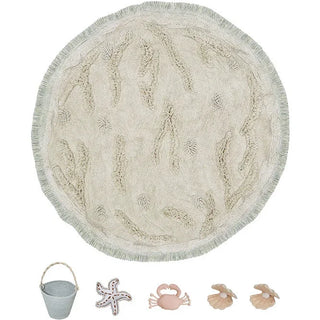 Rond speelvloerkleed met eilandmotieven en losse speelelementen.