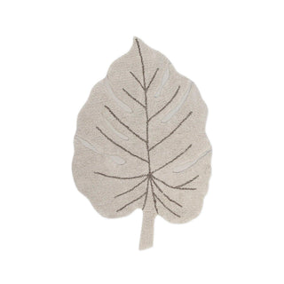 Naturel Monstera-vloerkleed in bladvorm met donkere nerven. Op witte achtergrond.