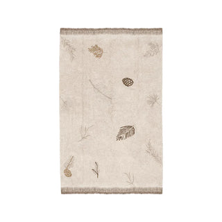 Naturel vloerkleed met dennenmotieven en franjes.