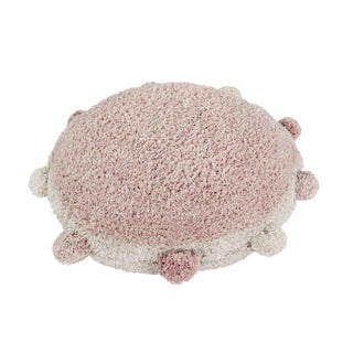 Rond roze vloerkussen met pompons.