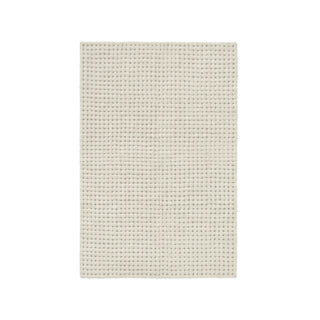 Reveal-vloerkleed met lichte rasterstructuur en ronde detailinzet.