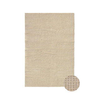 Eden-vloerkleed in lichte en zandkleurige tinten met ronde detailinzet.