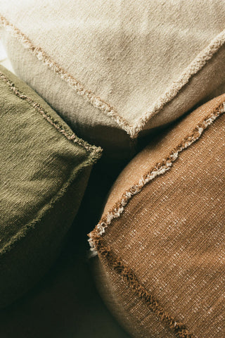 Drie kleuren Legacy-poefen bij elkaar met zichtbare randafwerking.