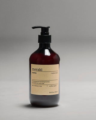 Meraki Northern Dawn shampoo van 490 ml op een grijze achtergrond