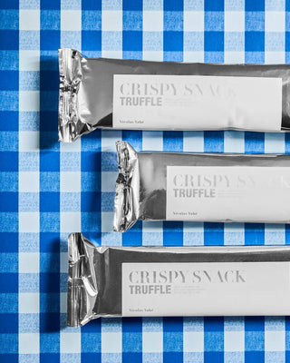 Crispy Snack Truffel – 75 g van Nicolas Vahe, in een culinaire setting met bijpassende ingrediënten
