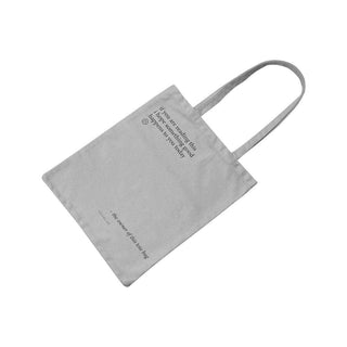 Katoenen tas Something good grijs van Typealive, aan de achterzijde met de opdruk zichtbaar